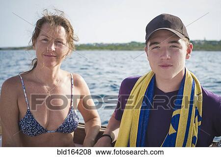Caucasian mother and son on boat View Large Photo Image Stock Photo - Caucasian mother and son on boat. Fotosearch
