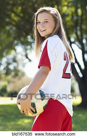 Caucasian soccer player holding ball View Large Photo Image Stock Photography - Caucasian soccer player holding ball. Fotosearch