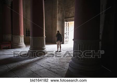 Caucasian tourist standing in ancient building View Large Photo Image Stock Image - Caucasian tourist standing in ancient building. Fotosearch