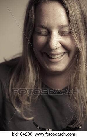 Stock Image - Caucasian woman laughing. Fotosearch