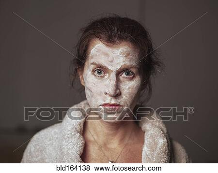 Caucasian woman wearing face cream and bathrobe View Large Photo Image Stock Photo - Caucasian woman wearing face cream and bathrobe. Fotosearch