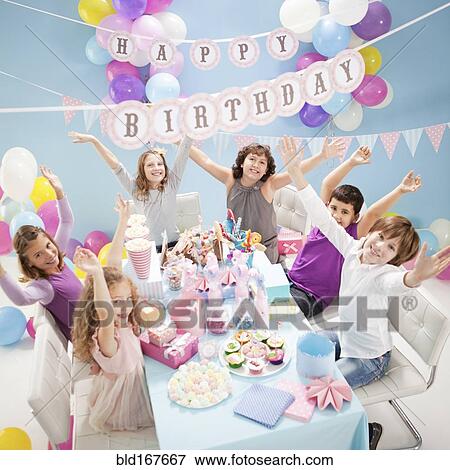 Children cheering at birthday party View Large Photo Image Stock Photo - Children cheering at birthday party. Fotosearch