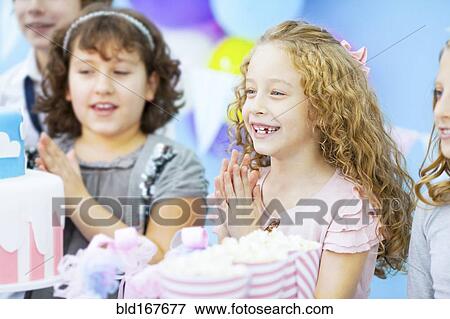 Children cheering at birthday party View Large Photo Image Stock Photo - Children cheering at birthday party. Fotosearch