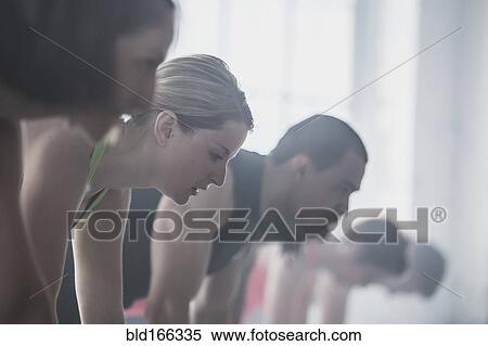 Close up of athletes looking down View Large Photo Image Stock Photography - Close up of athletes looking down. Fotosearch