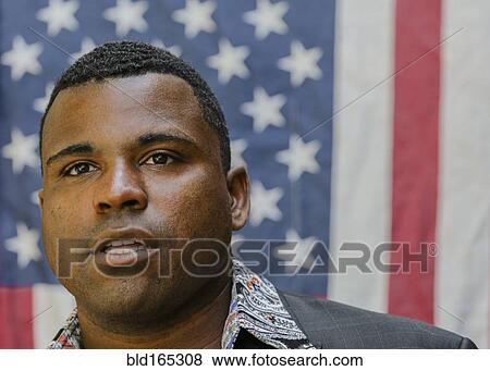 Close up of Black man in front of American flag View Large Photo Image Stock Photo - Close up of Black man in front of American flag. Fotosearch