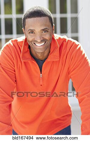 Close up of Black man smiling outdoors View Large Photo Image Picture - Close up of Black man smiling outdoors. Fotosearch