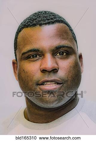 Stock Image - Close up of Black man smiling. Fotosearch