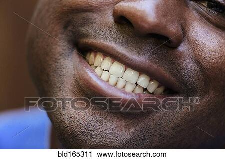 Close up of Black man smiling View Large Photo Image Stock Image - Close up of Black man smiling. Fotosearch