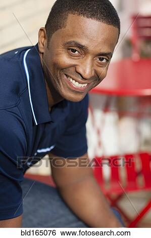 Close up of Black man smiling View Large Photo Image Stock Photograph - Close up of Black man smiling. Fotosearch