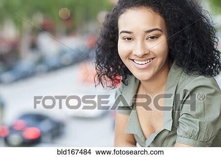 Close up of Black woman smiling outdoors View Large Photo Image Picture - Close up of Black woman smiling outdoors. Fotosearch