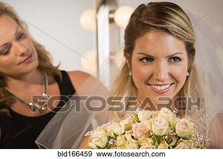 Close up of bride and maid of honor smiling View Large Photo Image Stock Photo - Close up of bride and maid of honor smiling. Fotosearch