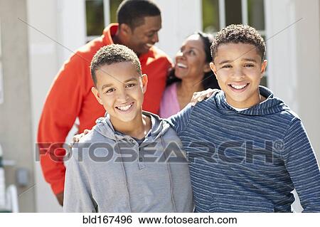 Close up of brothers hugging outdoors View Large Photo Image Stock Photograph - Close up of brothers hugging outdoors. Fotosearch