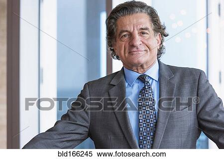 Stock Photography - Close up of businessman smiling. Fotosearch