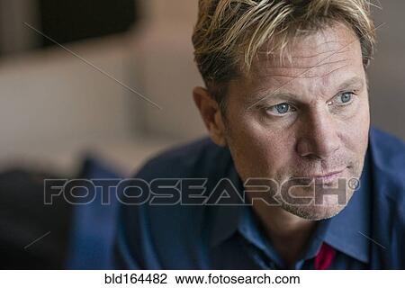 Stock Image - Close up of Caucasian businessman in office lobby. Fotosearch