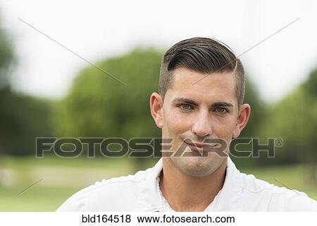 Close up of Caucasian man smiling outdoors View Large Photo Image Stock Photo - Close up of Caucasian man smiling outdoors. Fotosearch