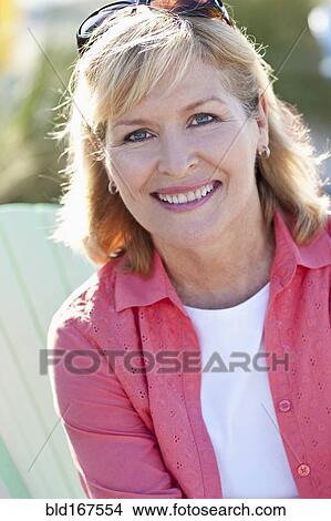 Picture - Close up of Caucasian woman smiling outdoors. Fotosearch