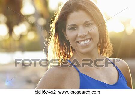 Close up of Caucasian woman smiling outdoors View Large Photo Image Stock Image - Close up of Caucasian woman smiling outdoors. Fotosearch