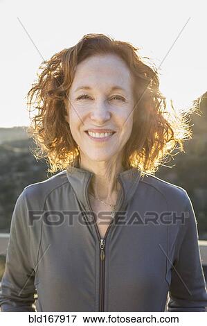 Close up of Caucasian woman smiling outdoors View Large Photo Image Stock Photo - Close up of Caucasian woman smiling outdoors. Fotosearch