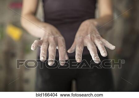 Picture - Close up of chalky hands of athlete in gym. Fotosearch