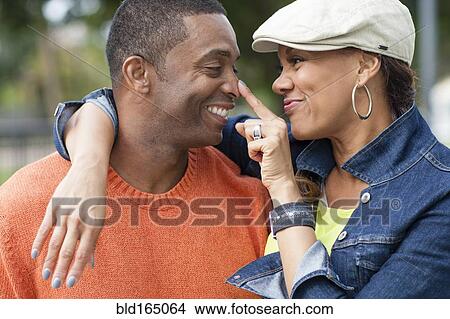 Picture - Close up of couple playing outdoors. Fotosearch