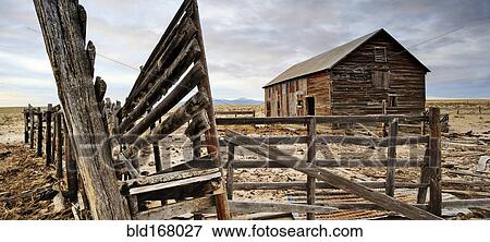 Close up of dilapidated fence and barn on abandoned farm View Large Photo Image Stock Photo - Close up of dilapidated fence and barn on abandoned farm. Fotosearch