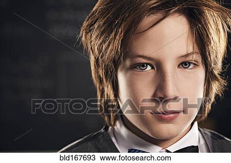 Close up of face of serious boy View Large Photo Image Stock Image - Close up of face of serious boy. Fotosearch