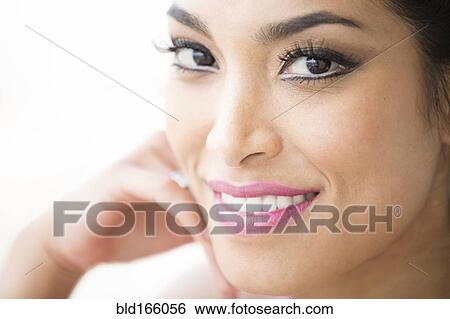 Close up of face of smiling Hispanic woman View Large Photo Image Stock Photograph - Close up of face of smiling Hispanic woman. Fotosearch