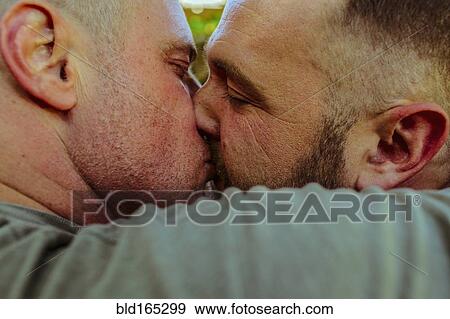Close up of gay couple kissing View Large Photo Image Stock Photo - Close up of gay couple kissing. Fotosearch
