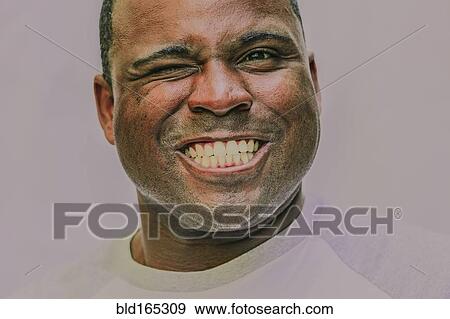 Close up of grinning Black man winking View Large Photo Image Stock Photo - Close up of grinning Black man winking. Fotosearch