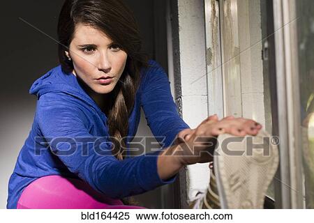 Close up of Hispanic athlete stretching View Large Photo Image Stock Photography - Close up of Hispanic athlete stretching. Fotosearch