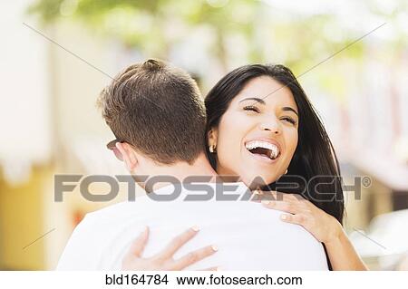 Close up of Hispanic couple hugging outdoors View Large Photo Image Picture - Close up of Hispanic couple hugging outdoors. Fotosearch