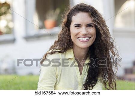 Close up of Hispanic woman smiling outdoors View Large Photo Image Picture - Close up of Hispanic woman smiling outdoors. Fotosearch