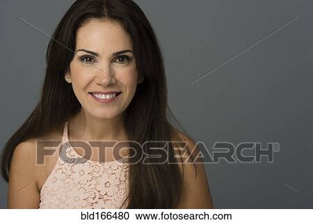 Stock Image - Close up of Hispanic woman smiling. Fotosearch