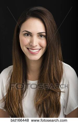 Stock Photo - Close up of Hispanic woman smiling. Fotosearch