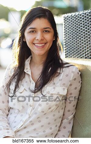 Stock Photography - Close up of Hispanic woman smiling. Fotosearch
