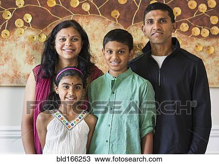 Stock Image - Close up of Indian family smiling. Fotosearch