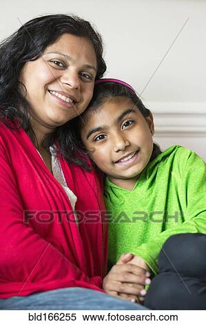 Close up of Indian mother and daughter smiling View Large Photo Image Stock Photography - Close up of Indian mother and daughter smiling. Fotosearch
