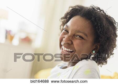 Close up of laughing Black girl View Large Photo Image Stock Photo - Close up of laughing Black girl. Fotosearch