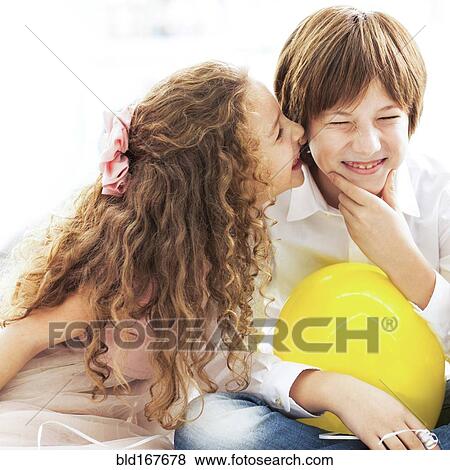 Close up of laughing children whispering View Large Photo Image Stock Photo - Close up of laughing children whispering. Fotosearch