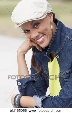 Close up of mixed race woman smiling View Large Photo Image Stock Photograph - Close up of mixed race woman smiling. Fotosearch