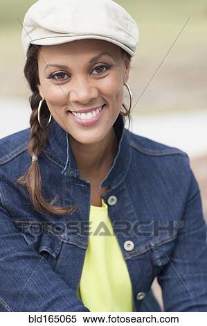 Stock Photography - Close up of mixed race woman smiling. Fotosearch