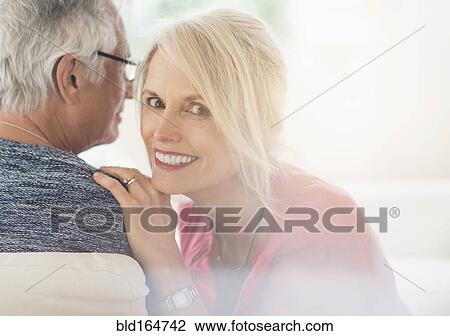 Close up of older Caucasian couple whispering View Large Photo Image Stock Image - Close up of older Caucasian couple whispering. Fotosearch