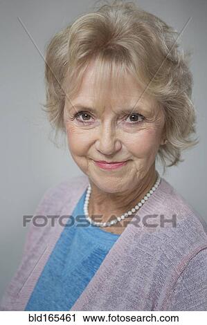 Stock Image - Close up of older Caucasian woman smiling. Fotosearch