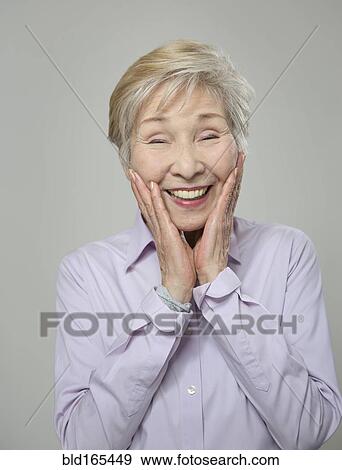 Stock Photo - Close up of older Japanese woman smiling. Fotosearch