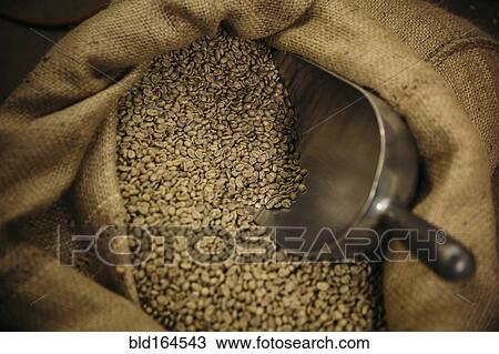 Stock Image - Close up of sack of raw coffee beans. Fotosearch