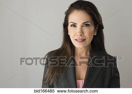 Stock Photography - Close up of serious Hispanic businesswoman. Fotosearch