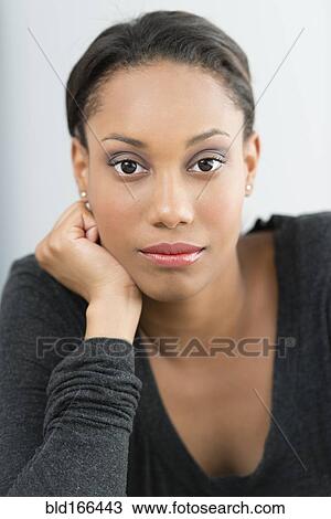 Close up of serious Mixed race woman View Large Photo Image Stock Image - Close up of serious Mixed race woman. Fotosearch