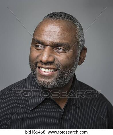 Stock Photo - Close up of smiling African American man. Fotosearch
