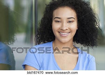 Stock Image - Close up of smiling Black woman. Fotosearch