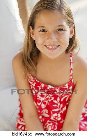 Stock Photography - Close up of smiling Caucasian girl. Fotosearch